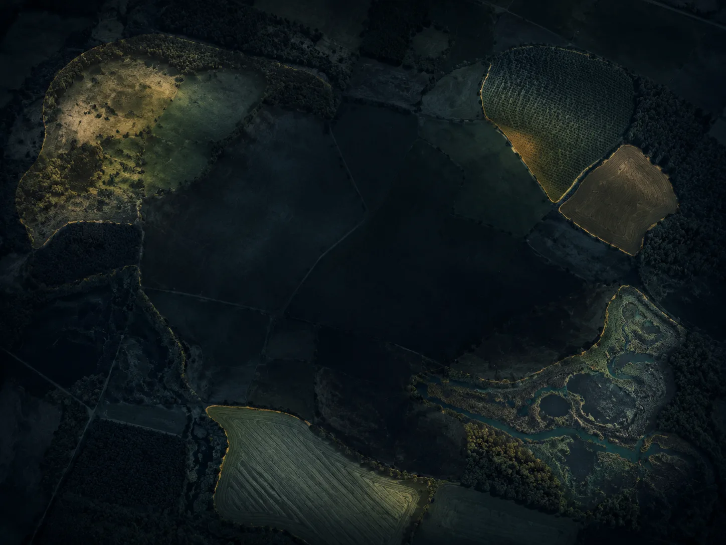 Aerial property mosaic with illuminated parcels around the edges